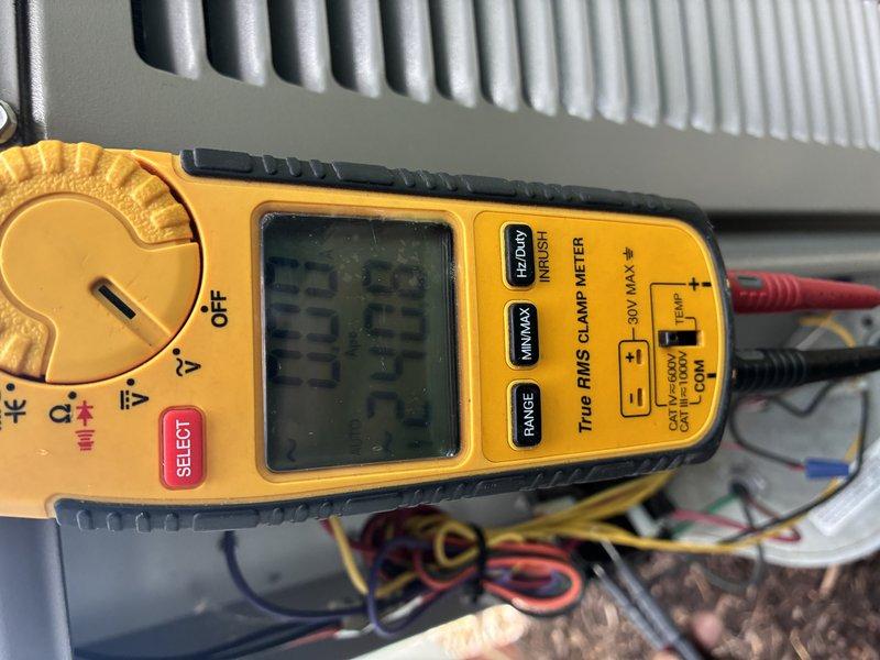 Completed preventive maintenance tune-up on 20+ year old air conditioning system covered under MVP contract. Performed comprehensive system inspection and testing using digital multimeter to verify electrical readings and system performance parameters. All measurements recorded at 23.75 on clamp meter during operational testing, indicating proper amperage draw within manufacturer specifications for aging equipment.