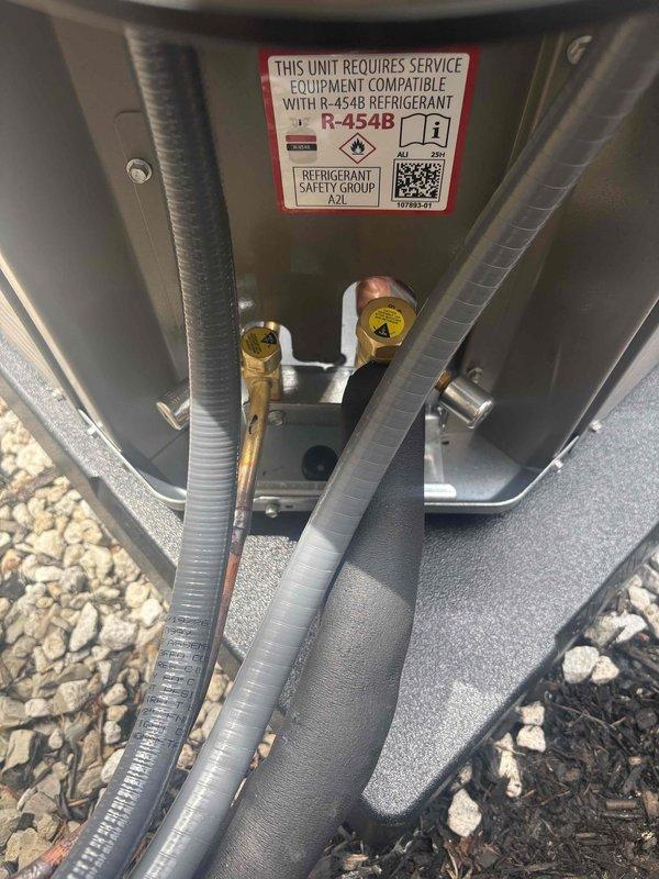 Completed installation of new air conditioning system with evaporator coil utilizing R-454B refrigerant. Installed FLNR 20A time-delay dual element fuses in outdoor unit disconnect, connected refrigerant lines to service valves, and verified all electrical connections were properly secured. System commissioned and operational.