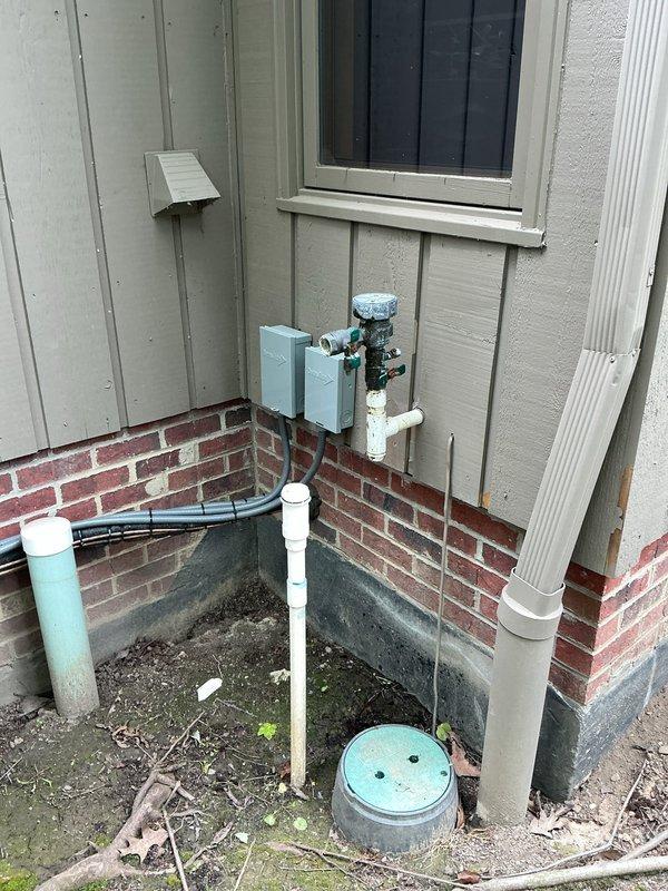 Completed irrigation system cap-off and addressed plumbing configuration in garage area. Installed PVC piping to properly terminate the irrigation system connections at the exterior foundation, ensuring all lines were securely capped to prevent water loss and system damage. Modified garage plumbing to provide cold water supply in addition to the existing hot water line, installing appropriate supply piping and connections to deliver full hot and cold water functionality to the space.