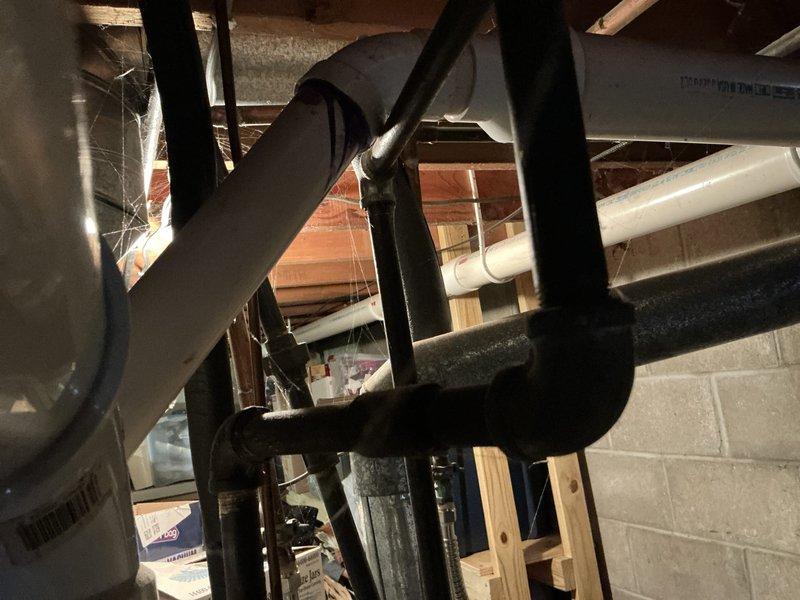 Conducted on-site assessment for complete HVAC system replacement at residential single-family home. Evaluated existing Concord furnace and split-system air conditioning equipment located in basement utility area. Documented current system configuration including ductwork, PVC venting arrangement, and equipment placement. Photographed existing furnace installation showing beige-colored unit with top-mounted PVC exhaust venting, gray metal supply plenum, and concrete floor installation. Assessed basement mechanical space infrastructure including exposed floor joists, concrete block walls, existing ductwork routing, and utility connections. Provided comprehensive replacement quote for new furnace and air conditioning system to homeowner.