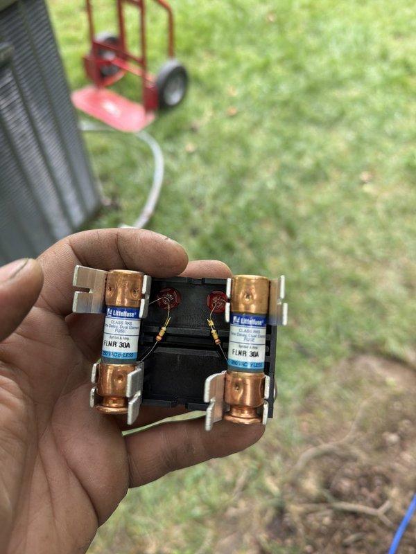 Completed full HVAC system installation including 80% efficiency furnace and air conditioning unit. Installed new Lennox outdoor condensing unit on pad with proper electrical disconnect and line set connections, ensuring all refrigerant lines and electrical components meet manufacturer specifications. Replaced dual 30-amp FLNR Littelfuse fuses in disconnect box to protect new equipment from electrical overload.