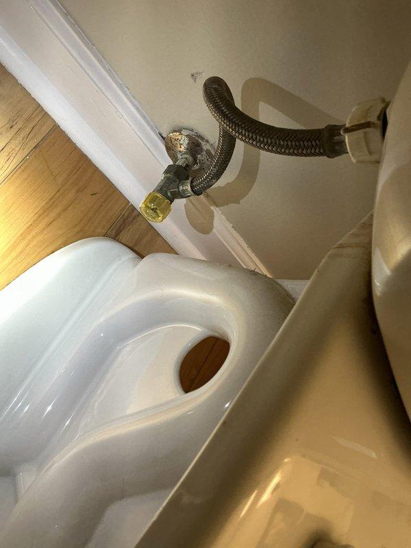 Responded to service call for leaking drain pipe in basement identified during home inspection. Upon arrival, conducted thorough assessment of plumbing system and basement drainage infrastructure. Inspected water supply connections throughout the property, including toilet supply line configuration in bathroom. Documented existing plumbing conditions with photographic evidence showing toilet installation, water supply flex hose positioning, and overall bathroom fixture setup. Verified proper operation of water supply connections and assessed potential sources of reported drainage leak. Completed diagnostic evaluation of basement plumbing system to identify leak origin and recommend appropriate repair solutions.