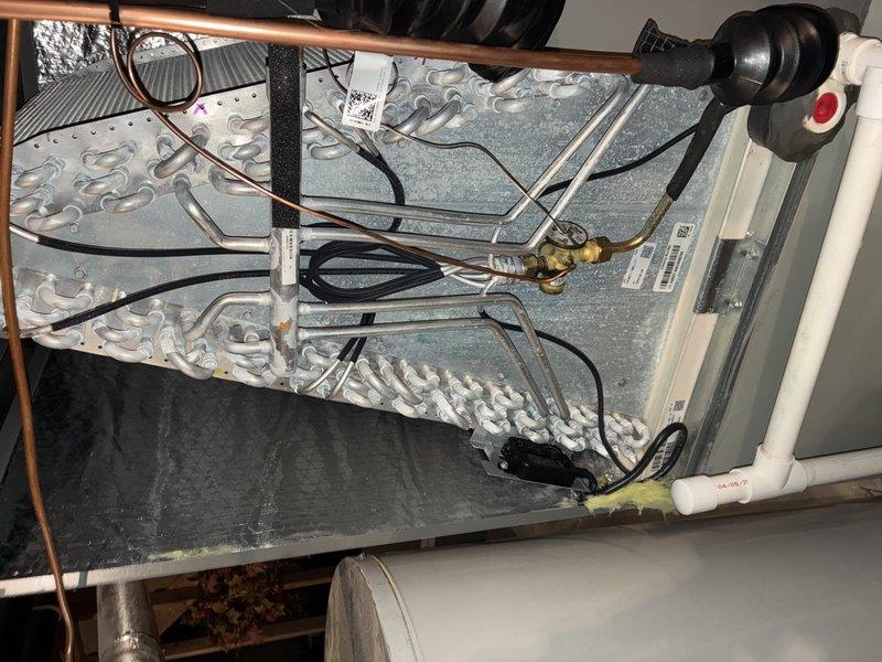 Performed annual maintenance on residential air conditioning system. Inspected evaporator coil and condenser fins, noting dust accumulation on heat exchanger surfaces. Examined air handler unit components including refrigerant lines, electrical connections, condensate drainage system, and all mechanical assemblies. Addressed customer concern regarding thermostat not maintaining set temperature of 70 degrees, with unit experiencing temperature drift above setpoint.
