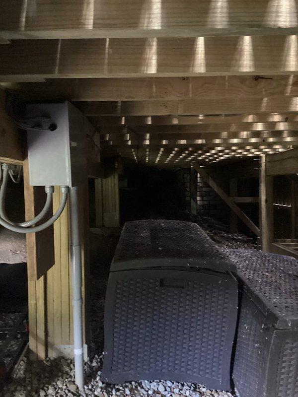 Conducted site assessment for underground electrical line relocation required for planned pool installation. Inspected existing electrical service panel in crawl space area, documented current breaker configuration and available capacity, and evaluated underground service routing beneath deck structure. Provided estimate for relocating electrical line to accommodate new pool construction while maintaining code compliance and proper clearances.