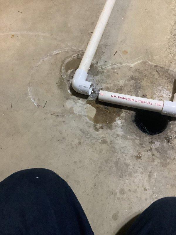 Responded to service call for leaking Aprilaire humidifier and furnace exhaust pipe intrusion by birds. Inspected PVC condensate drain lines and furnace venting system on concrete floor in mechanical area. Addressed water leakage issue from humidifier unit and recommended installation of vent termination cap or bird guard on exterior exhaust pipe opening to prevent future wildlife entry into flue system.