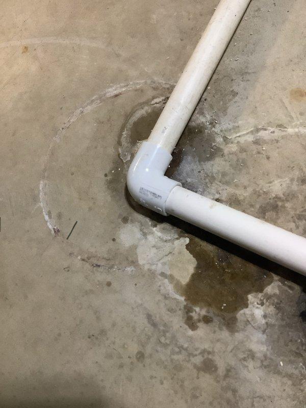 Responded to service call for leaking Aprilaire humidifier and furnace exhaust pipe intrusion by birds. Inspected PVC condensate drain lines and furnace venting system on concrete floor in mechanical area. Addressed water leakage issue from humidifier unit and recommended installation of vent termination cap or bird guard on exterior exhaust pipe opening to prevent future wildlife entry into flue system.