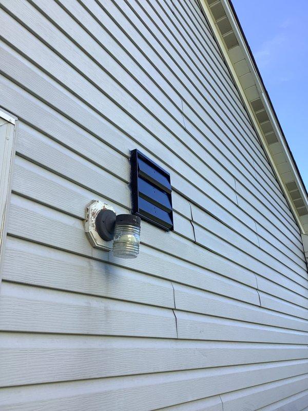Installed customer-provided exhaust fan in residential bathroom, connecting unit to existing electrical switch as requested. Mounted fan securely in wall opening, wired to pre-existing switch for convenient operation, and installed exterior louvered vent cover on building's exterior wall to facilitate proper air discharge. Verified all electrical connections for safety and tested fan operation to ensure proper functionality.