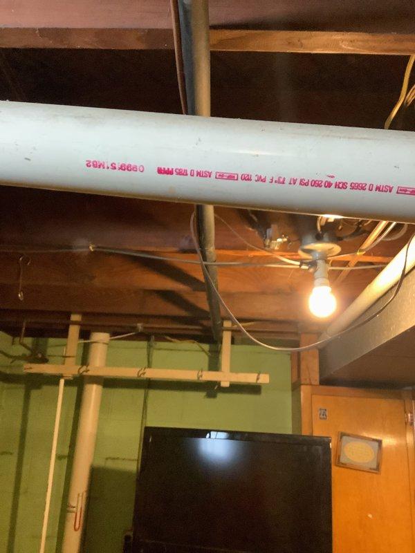 Conducted comprehensive assessment of existing Trane cylindrical outdoor condensing unit for replacement estimate. Unit showed significant debris accumulation on top-mounted fan assembly and required evaluation for complete system replacement. Inspected basement area to assess existing ductwork, plumbing infrastructure, and available space for potential new equipment installation.