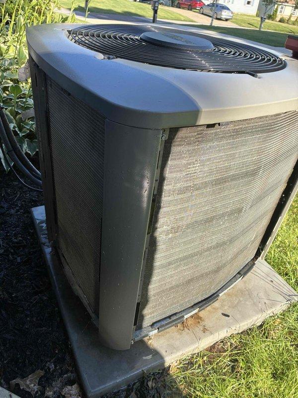 Performed routine maintenance on a 7-year-old residential air conditioning system as part of an existing maintenance plan. Inspected outdoor condenser unit and noted significantly soiled side filter/grille with heavy dust and debris accumulation. Cleaned condenser coils and filter panels to restore proper airflow and system efficiency. Verified system operation and measured supply air temperature at 53°F, confirming adequate cooling performance. Unit returned to normal operating condition.