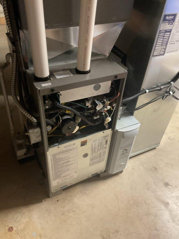 Completed MVP cooling maintenance visit on two residential HVAC systems. Performed comprehensive inspection of Lennox SL18XP1-024 outdoor condensing unit containing HFC-410A refrigerant with 8 lbs 6 oz factory charge, verified unit specifications and proper operation. Conducted interior system inspection including furnace blower assembly, electrical connections, and associated air handling equipment, documented equipment condition with specification labels visible for service records.