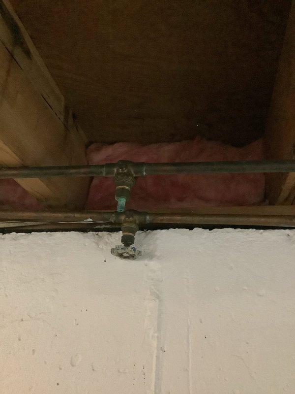 Completed comprehensive plumbing inspection of residential property at 8am, examining supply lines and fixtures throughout the home. Inspected crawl space plumbing infrastructure, including copper supply lines with shutoff valve assembly and T-joint connections serving upper fixtures, confirming proper installation and functionality. Examined bathroom toilet installation, fill valve mechanism, and flush valve assembly to verify proper operation and identify any potential maintenance needs.