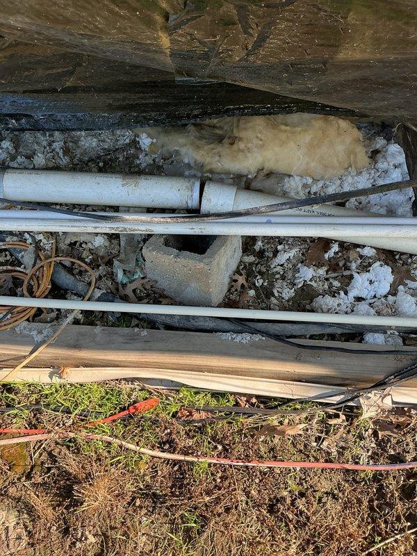 Conducted comprehensive inspection of crawl space plumbing and gas line infrastructure to provide estimate for complete replacement of all gas lines and plumbing pipes. Assessed existing deteriorated conditions including corroded metal pipes, aged PVC water lines with visible degradation, and identified active water leak in piping system. Documented extensive weathering of existing utility infrastructure, compromised insulation, and structural accessibility for planned replacement work.