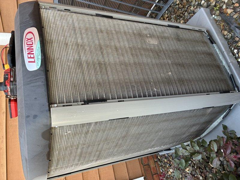 Completed scheduled MVP cooling maintenance visit on 5-year-old Lennox heat pump system. Performed comprehensive inspection of outdoor unit, documenting condition of condenser coils which showed moderate dust and dirt accumulation consistent with normal operation. Inspected control board and electrical connections within unit, verifying all wire harnesses, relays, and terminal blocks were secure and properly organized. All components functioning within normal parameters at time of service.