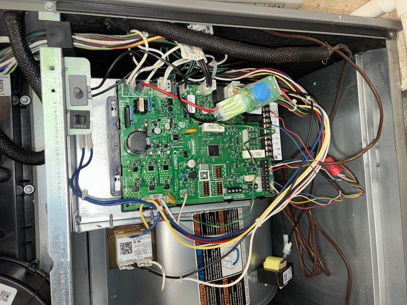 Completed scheduled MVP cooling maintenance visit on 5-year-old Lennox heat pump system. Performed comprehensive inspection of outdoor unit, documenting condition of condenser coils which showed moderate dust and dirt accumulation consistent with normal operation. Inspected control board and electrical connections within unit, verifying all wire harnesses, relays, and terminal blocks were secure and properly organized. All components functioning within normal parameters at time of service.