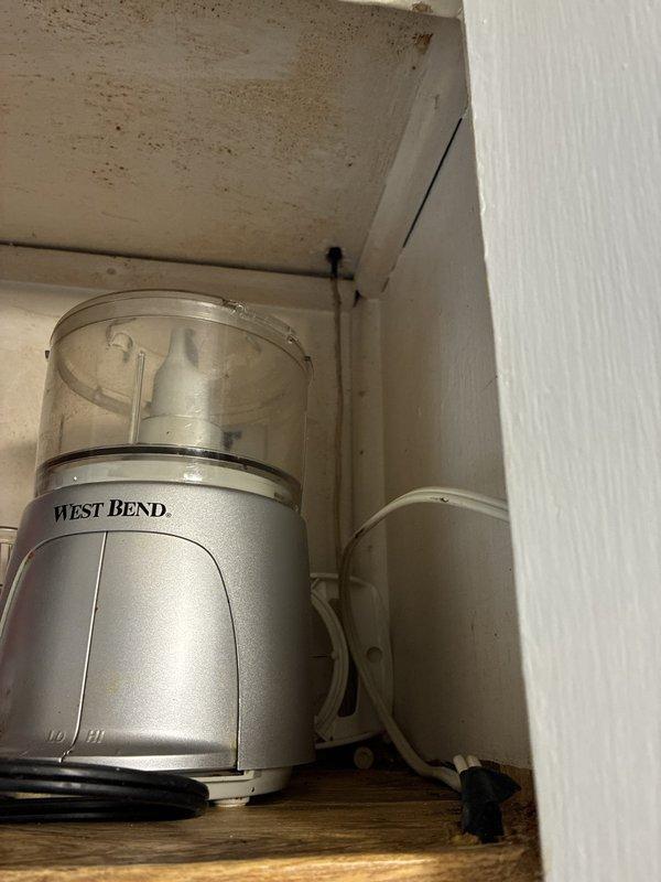 Arrived on-site to provide estimate for installing dedicated electrical outlet for dishwasher. Assessed existing electrical infrastructure in kitchen cabinet area and unfinished adjacent space, documented current conditions including exposed wiring and junction box locations. Customer provided with quote for outlet installation to support new dishwasher appliance.