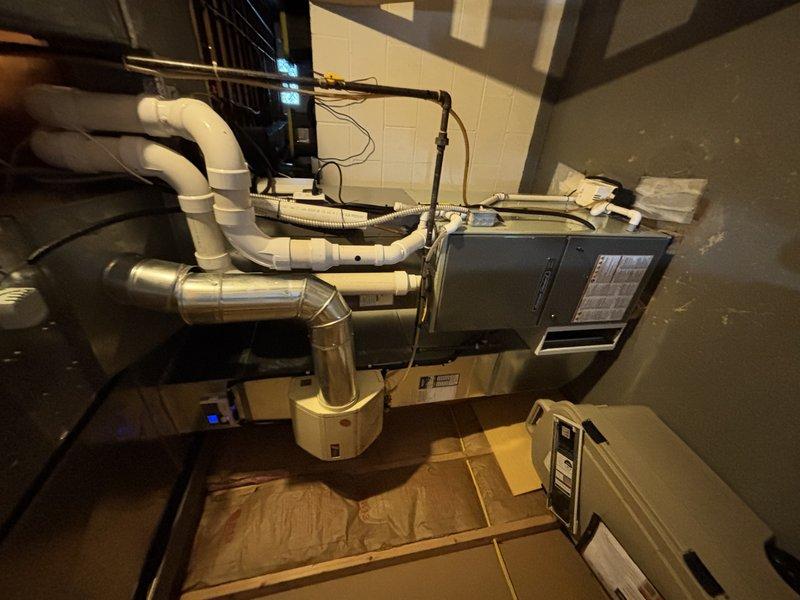 Responded to water leak behind HVAC unit and confirmed condensation pump failure. Replaced defective condensation pump, verified proper drainage operation, and tested system to ensure no further water leakage. System returned to normal operation with condensate properly evacuating through drain lines.