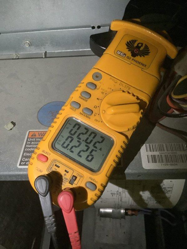 Completed MVP cooling maintenance visit on two residential HVAC units located in basement and attic. Performed comprehensive system inspections including electrical testing with digital multimeter, verified proper voltage and amperage readings on both units, and documented equipment conditions through photography. Inspected attic-mounted air handler unit, refrigerant lines, and associated ductwork connections for proper operation and secure mounting.