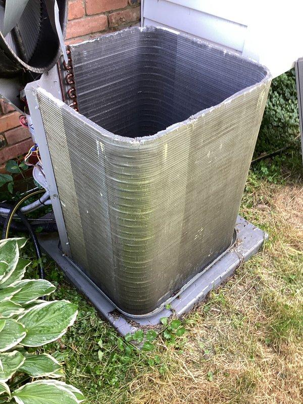 Completed MVP recurring cooling maintenance visit on residential air conditioning system. Performed electrical diagnostics using digital multimeter to verify proper voltage and amperage readings at the outdoor condenser unit. Inspected exterior condensing unit showing weathering and algae growth on lower sections; unit operational with all components functioning within normal parameters.