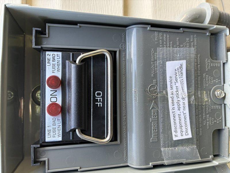 Completed MVP AC maintenance on cooling system. Identified and documented failed 20-amp Littelfuse FLNR fuses in outdoor disconnect switch showing oxidation and weathering from environmental exposure. Inspected electrical disconnect assembly and confirmed fuse failure indicators on safety switch mechanism. Photographed damaged components for service records and customer documentation.