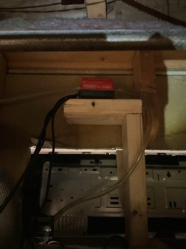 Responded to service call for 3-year-old LG mini split system experiencing water leakage. Inspected wall-mounted indoor unit and accessed attic space above to examine condensate drain line routing and connections. Identified drainage issue, cleared blockage from condensate line, verified proper pitch and flow, and tested system operation to confirm leak was resolved.
