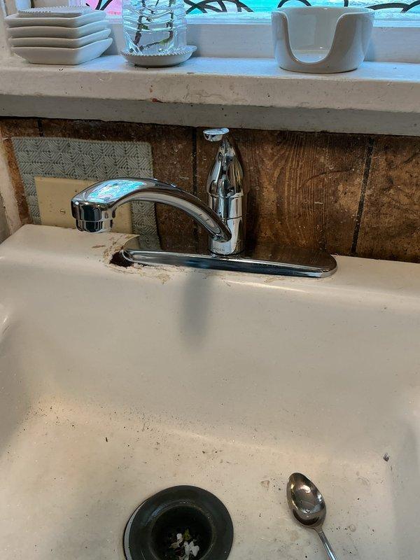 Completed replacement of kitchen faucet with new chrome single-handle unit and installed three new shut-off valves under the kitchen sink. Removed existing faucet assembly and disconnected old supply lines from worn valves. Installed new angle stop valves on hot and cold water supply lines to provide reliable shutoff capability and prevent future leaks. Mounted new faucet to sink deck, connected supply lines to new valves, and tested all connections for proper operation and water-tight seals. All fixtures are functioning correctly with no leaks detected.