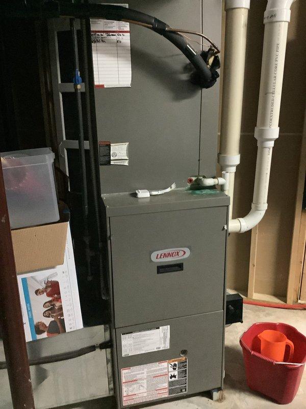 Responded to service call for two-zone HVAC system with communication issues between Ecobee thermostats and Aprilaire zone control panel. Inspected Lennox furnace unit and Aprilaire zone controller, verified wiring connections, and assessed system configuration. Identified improper communication protocol between zone dampers and thermostat controls requiring further programming or equipment compatibility adjustment.