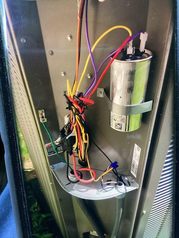 Responded to service call for newly installed A/C unit reported to be excessively loud with unusual noises. Performed diagnostic inspection of system components including compressor, capacitor, and electrical connections. Verified unit is operating within normal parameters and cooling effectively. Inspected compressor mounting, refrigerant lines, and electrical wiring for any loose connections or installation issues. Documented system condition with photos showing properly installed capacitor, secure electrical connections, and compressor assembly. Advised customer that operational sounds are consistent with normal system operation and not related to installation defect or warranty claim.