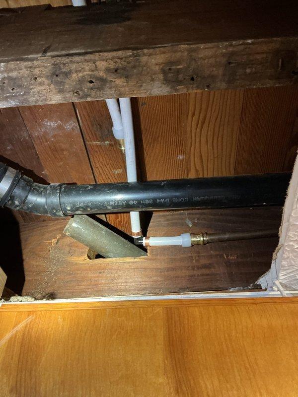 Removed existing galvanized piping throughout the residence and replaced with updated water supply system. Started at the incoming flange copper fitting, transitioning to new copper pipe with ball valves installed before and after the meter. Ran new copper piping to tie into existing CPVC system. Installed new PEX piping through exposed wall cavities from basement to second floor, supplying shower, lavatory faucet, and toilet with fresh water lines. Coordinated municipal water shutoff at street level for safe execution of work. Homeowner completed drywall removal in basement and kitchen ceiling areas prior to arrival, providing access to work areas. Performed minimal additional drywall removal as needed during installation to ensure proper pipe routing and connections. All new piping installed to code specifications with proper support and securing throughout the run.