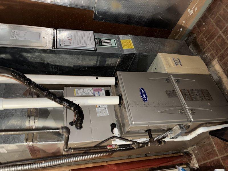 Completed MVP recurring cooling maintenance visit on 7-year-old system. Inspected Carrier furnace/air handler unit and associated components in basement mechanical room, verified proper operation of equipment, PVC condensate drainage, and electrical connections. Replaced HVAC air filters with clean units, confirmed all safety labels and specifications visible and intact on equipment.