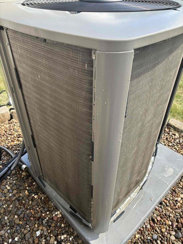 Responded to service call for loud rattling noise on startup of 4-year-old air conditioning system during MVP recurring maintenance visit. Performed comprehensive inspection of outdoor condenser unit, which appeared in good overall condition with clean coils and proper installation on concrete pad. Measured supply air temperature at 71.5°F using calibrated digital thermometer to verify system operation and cooling performance. Unit was found to be functioning properly at time of inspection with no immediate rattling detected, though intermittent noise complaints may require monitoring during future startup cycles or extended run time to diagnose potential loose mounting hardware, fan blade issues, or compressor mounting concerns.