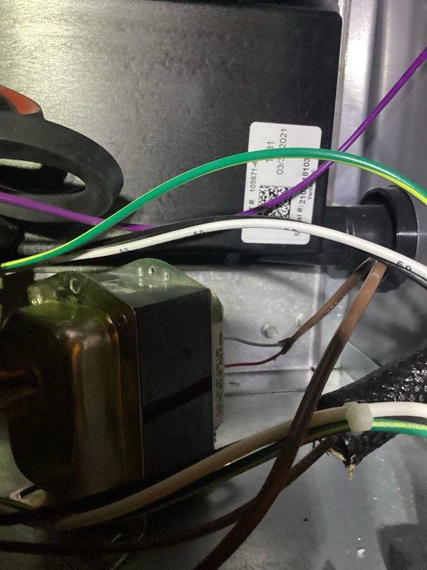 Responded to warranty call for loud banging noise from Lennox AC unit installed one year ago. Upon inspection, accessed internal electrical components and identified issue with transformer/relay assembly. Documented equipment condition and electrical connections including multiple wire terminations. Unit evaluated and serviced to resolve noise concern under manufacturer warranty coverage.