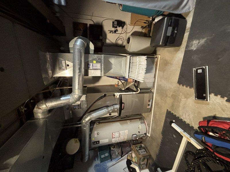 Completed preventive maintenance visit on 10-year-old residential air conditioning system. Performed comprehensive system diagnostics using refrigerant analyzer to verify proper charge levels and system pressures. Inspected furnace and air handler assembly, checked air filter condition, and verified all mechanical components for proper operation. All equipment found operating within normal parameters with no immediate service needs identified.