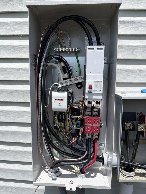 Completed installation of 18kW Generac whole home generator system with 200-amp automatic transfer switch. Ran 60 feet of electrical supply line from main service panel to transfer switch location and 30 feet of natural gas supply line to generator unit. Installed transfer switch in utility area with proper grounding and bonding, wired all necessary circuits for whole home backup coverage, and mounted Generac control module. Terminated all power conductors at transfer switch, verified proper phasing, and completed all electrical connections per manufacturer specifications and local code requirements. System tested and operational, ready for automatic transfer during power outages.