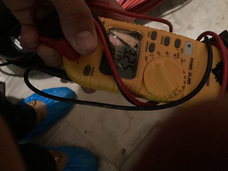 Performed routine air conditioning maintenance and system checkup on residential cooling unit. Conducted electrical testing using digital multimeter to verify proper voltage and amperage at outdoor disconnect box. Inspected dual cartridge fuses and electrical connections at exterior disconnect panel, confirming all components were functioning within normal operating parameters. Unit tested successfully with no issues identified during inspection.