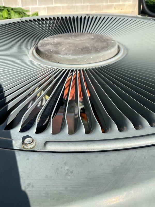 Performed comprehensive air conditioning maintenance on an 18-year-old outdoor condenser unit. Inspected fan assembly, coil components, and electrical connections housed in the DiversiTech disconnect box. Unit operational with all components functioning within normal parameters upon completion of routine maintenance procedures.