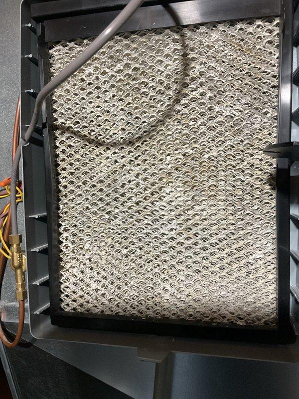 Completed scheduled MVP cooling maintenance visit. Performed system diagnostics using digital testing equipment to verify proper operation and measured critical parameters on the air handler unit. Inspected and documented the condition of the air filtration system, noting accumulated dust and debris on the pleated filter media requiring attention during this preventive maintenance service.