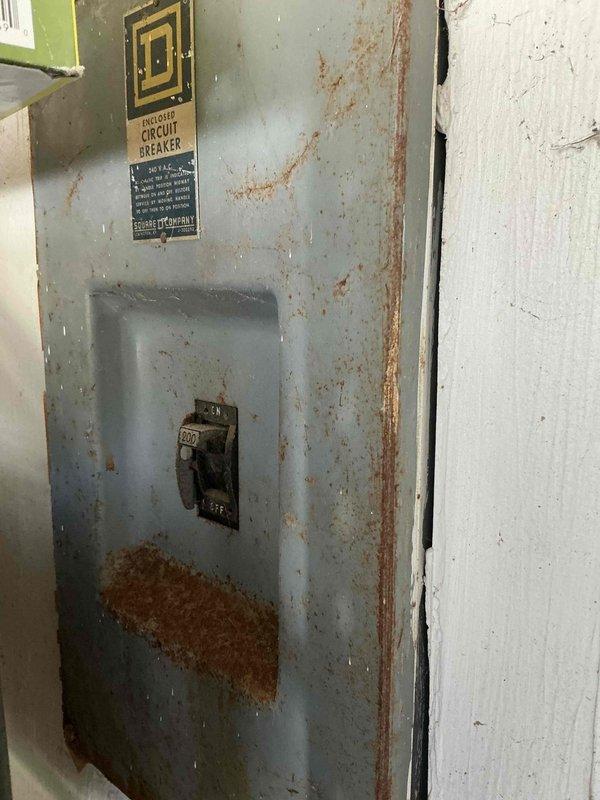 Conducted comprehensive site assessment for residential backup generator installation. Evaluated existing electrical infrastructure, including aged main service panel showing significant corrosion and rust deterioration requiring replacement or upgrade prior to generator integration. Documented installation location options in utility area, assessed structural mounting requirements, and determined optimal positioning for generator unit considering clearances, ventilation, and code compliance. Photographed existing conditions and prepared detailed estimate for complete generator system installation including transfer switch, necessary electrical panel upgrades, and associated materials.
