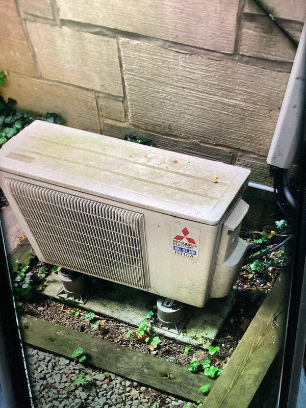 Responded to no cooling complaint on 16-year-old mini split system serving second floor master bedroom. Upon inspection, outdoor condenser unit showed significant age-related weathering and debris accumulation. Accessed electrical panel and evaluated internal components including capacitor, transformer, and wiring connections for proper operation and potential failure points contributing to loss of cooling capacity.