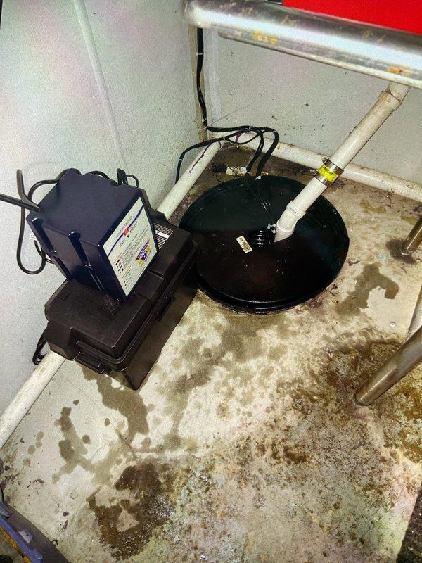 Removed and discarded existing sump pump battery backup system. Installed new 1/3 horsepower primary sump pump with integrated battery backup system, including maintenance-free battery for emergency operation during power outages. System installed in existing sump basin with proper discharge piping connections and electrical wiring. All components tested and verified operational, with one-year warranty provided on installation.