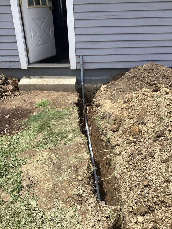 Installed a dedicated 50-amp, 240V circuit from the main electrical panel in the basement to a detached garage. Removed an existing abandoned Romex circuit from the panel to free up the necessary breaker slots, then installed a junction box to transition from Romex to THHN conductors. Excavated and trenched from the home to the garage, installed underground conduit and wiring, and established a proper grounding system for the detached structure. Populated the garage subpanel with spare breakers including four 2-pole 20-amp and three single-pole 20-amp breakers for future expansion.