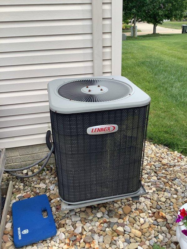 Responded to service call for 19-year-old Lennox air conditioning condenser unit producing excessive noise. Upon inspection, identified failed dual run capacitor exhibiting severe corrosion, rust deterioration on terminal connections, and turquoise-colored copper oxidation buildup around wire terminals. Replaced defective capacitor with new unit, verified proper electrical connections, and tested system operation. Unit now running quietly with normal operating parameters restored.