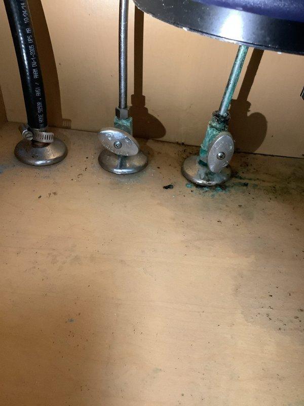 Replaced kitchen faucet at residential property due to wear and functionality issues. Removed existing brushed stainless steel faucet assembly including spray attachment, disconnected supply lines from underneath sink, and installed new faucet with matching finish. Inspected supply line connections during installation and noted significant copper corrosion and mineral buildup on water supply pipes beneath the sink, typical of aging plumbing systems. Tested new faucet for proper operation and verified no leaks at connection points.