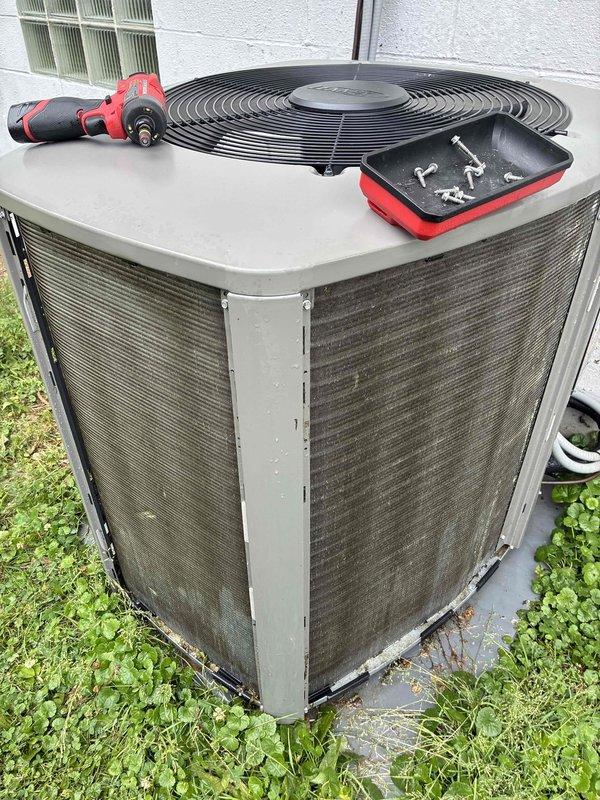 Performed comprehensive cooling maintenance on 2-year-old air conditioning system. Completed full system inspection of outdoor condenser unit, including cleaning of coils and protective grilles, verification of proper airflow through louvered panels, and inspection of fan assembly. All components were found to be operating within normal parameters, with unit showing good overall condition for its age.