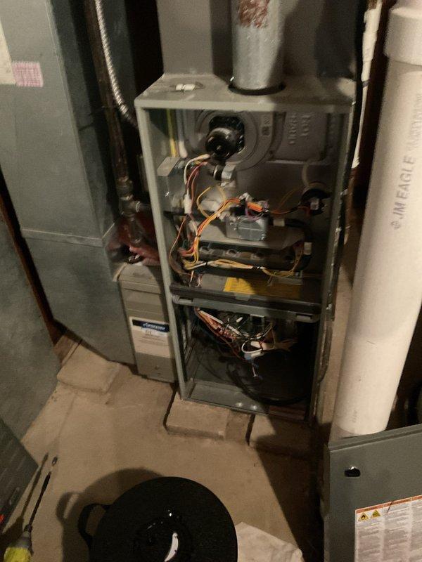 Responded to service call for thermostat malfunction where customer was unable to switch system from heating to cooling mode. Inspected HVAC system and thermostat wiring, accessed furnace cabinet to examine internal components and control board connections. Diagnosed and resolved thermostat communication issue, verified proper system operation and successful mode switching between heating and cooling functions.