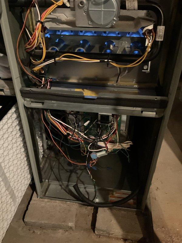 Responded to service call for thermostat malfunction where customer was unable to switch system from heating to cooling mode. Inspected HVAC system and thermostat wiring, accessed furnace cabinet to examine internal components and control board connections. Diagnosed and resolved thermostat communication issue, verified proper system operation and successful mode switching between heating and cooling functions.