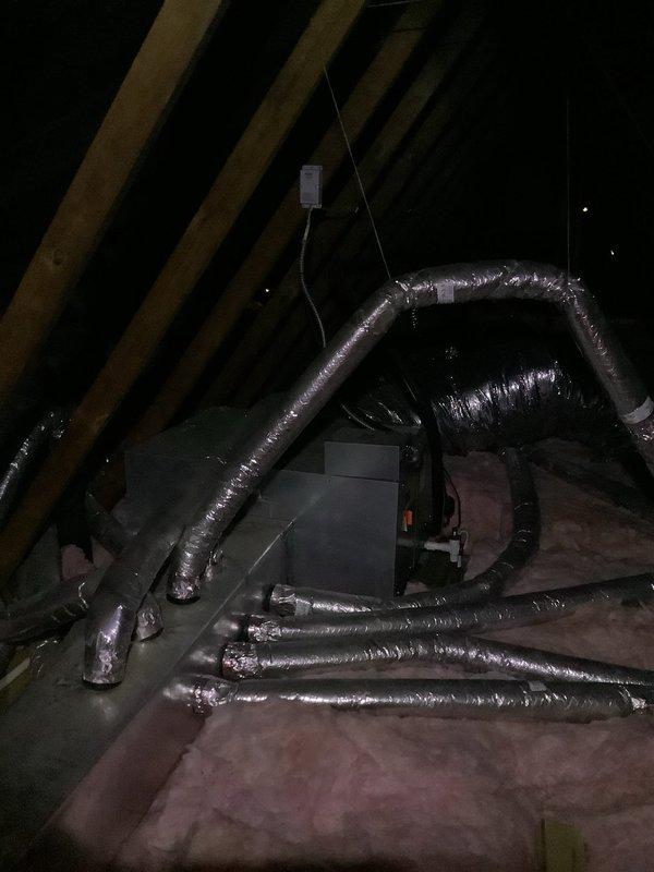 Completed routine preventive maintenance visit on 15-year-old attic-mounted air handler and outdoor condensing unit. Accessed attic equipment using customer-provided ladder, inspected ductwork and insulation for proper installation and condition, verified air handler operation and electrical connections. Inspected outdoor condensing unit mounted on concrete pad, checked refrigerant lines, electrical connections, and fan operation. Both indoor and outdoor components operating within normal parameters at time of service.