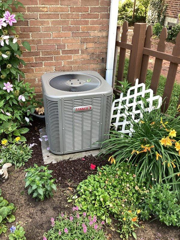 Completed scheduled BS-MVP cooling maintenance visit on 5-year-old Lennox air conditioning system. Performed comprehensive inspection of outdoor condensing unit, verified proper operation of all components, and documented equipment condition with photographs showing unit in well-maintained landscaped area with adequate clearance for airflow.