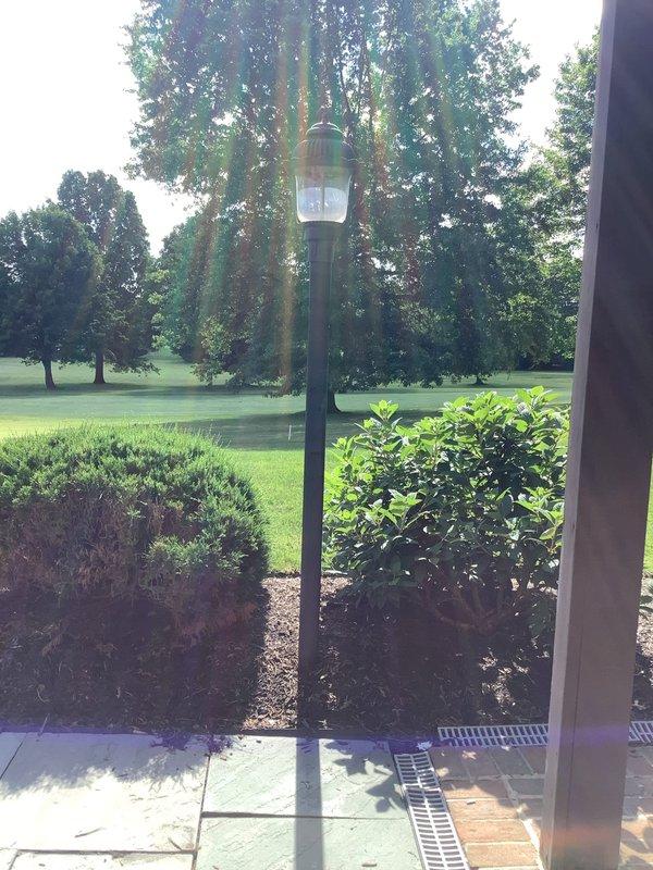 Disconnected and removed exterior gas lamppost from property. Upon completion of removal, lamppost components were left on the neighbor's porch at the specified address per customer arrangement for reuse purposes. All gas line connections were properly capped and secured to ensure safety compliance.