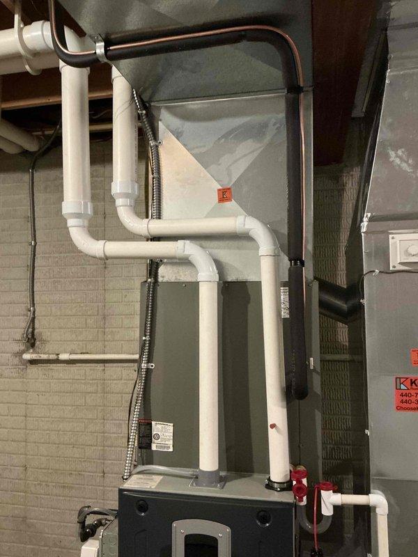 Provided comprehensive estimate for complete HVAC system replacement of 19-year-old equipment. Documented existing furnace, air handler, and associated components including PVC venting, condensate drainage system, refrigerant lines, and electrical connections for replacement quote preparation.