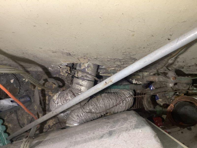 Responded to service call for 8-year-old natural gas water heater with pilot light failure. Upon arrival, inspected A.O. Smith tank-style water heater located in basement utility area. Confirmed pilot would not ignite or remain lit, with no status indicator light flashing on gas control valve. Accessed burner assembly and thermocouple to diagnose ignition system failure. Given the age of the unit, visible exterior rust deterioration, and pilot safety system malfunction, determined that thermocouple replacement or gas valve replacement would be necessary to restore proper operation.
